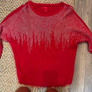 Jennifer Lopez Red Sweater with Silver Detailing